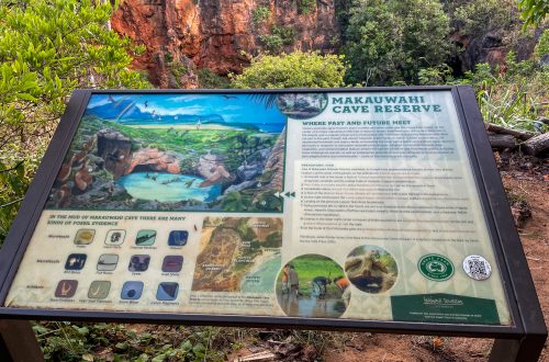 An informational sign for Makauwahi Cave Reserve on Kauai