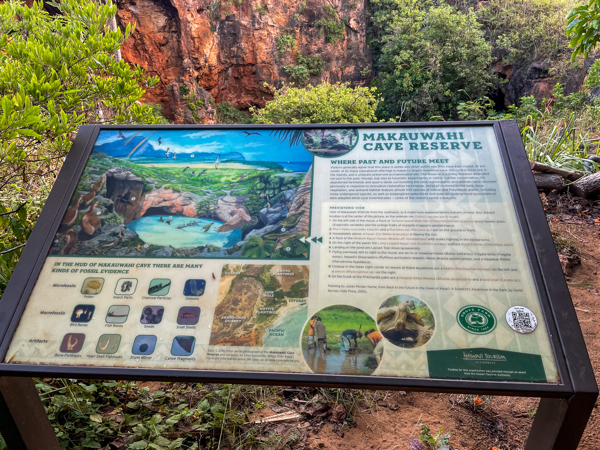 An informational sign for Makauwahi Cave Reserve on Kauai